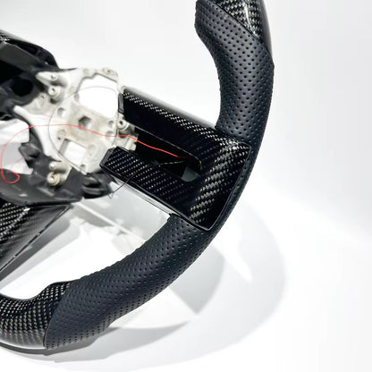 Volante Mustang 2007-2014 fibra de carbono/cuero perforado