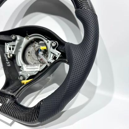 Volante Golf MK4 Fibra de Carbono/Cuero Perforado