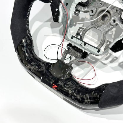 Volante Nissan 370Z/Juke Fibra forjada/LEDs/Alcantara Italiana